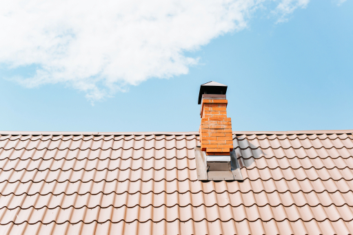 Chimney cap installed on a tile roof