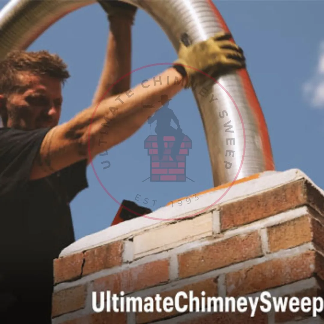 Technician installing a stainless steel chimney liner and cap